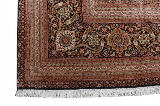 Corner detail of 2000s Tabriz rug showing border pattern and Cork pile