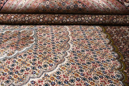 Surface texture of 2000s Tabriz rug with natural Cork and intricate pattern