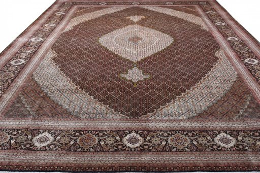 Surface texture of 2000s Tabriz rug with natural Cork and intricate pattern
