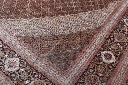 Backside of handmade 2000s Tabriz rug showing knot structure and weave density