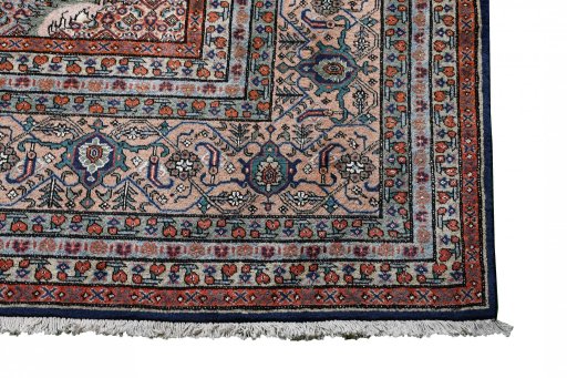 Surface texture of 2000s Tabriz rug with natural Wool and intricate pattern