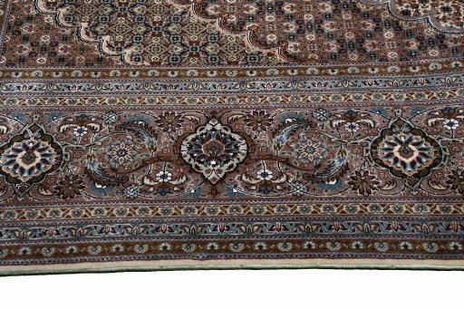 Surface texture of New Tabriz rug with natural Wool and intricate pattern