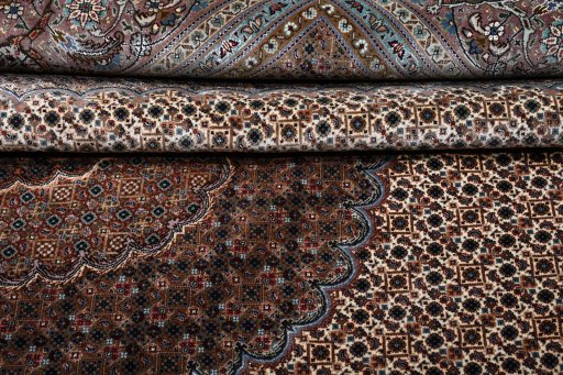 Close-up detail of New Tabriz rug from Iran / Persia showing Wool weave