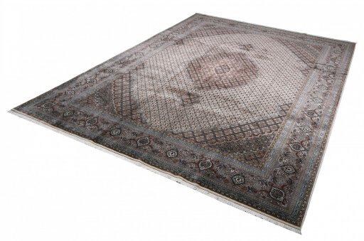 Close-up detail of New Tabriz rug from Iran / Persia showing Wool weave