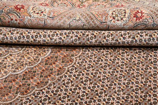 Backside of handmade New Tabriz rug showing knot structure and weave density