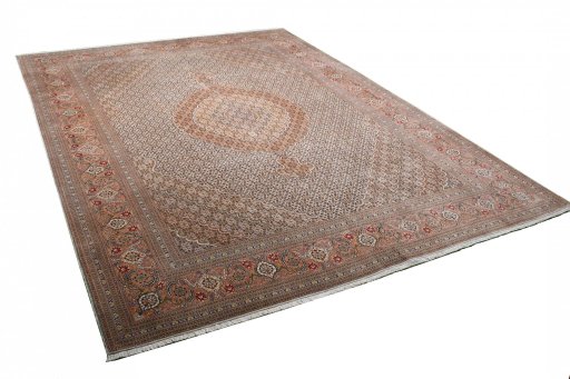 Corner detail of New Tabriz rug showing border pattern and Wool pile