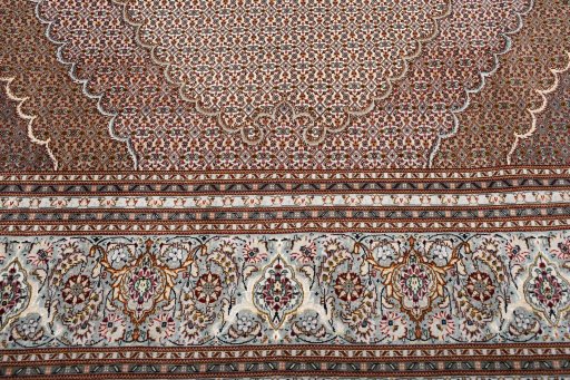 Backside of handmade New Tabriz rug showing knot structure and weave density