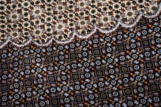 Corner detail of New Tabriz rug showing border pattern and Cork pile