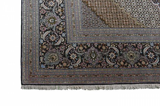 Backside of handmade New Tabriz rug showing knot structure and weave density