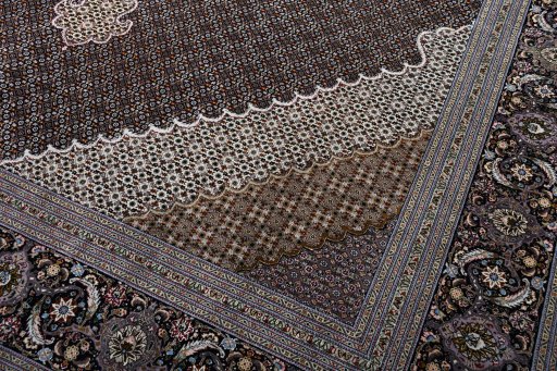 Backside of handmade New Tabriz rug showing knot structure and weave density