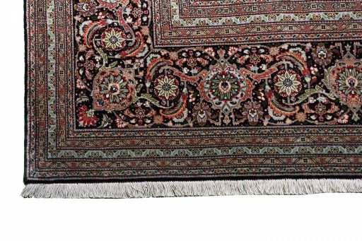 Backside of handmade New Tabriz rug showing knot structure and weave density