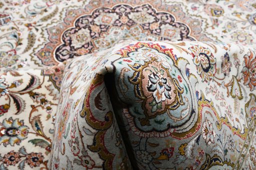 Backside of handmade New Tabriz rug showing knot structure and weave density