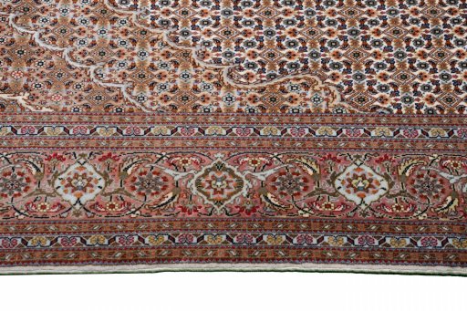 Corner detail of New Tabriz rug showing border pattern and Cork pile