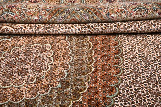 Backside of handmade New Tabriz rug showing knot structure and weave density