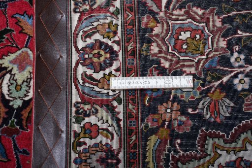 Surface texture of 2000s Tabriz rug with natural Cork and intricate pattern