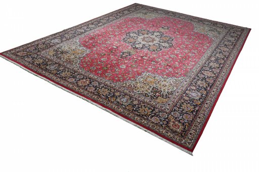 Corner detail of 2000s Tabriz rug showing border pattern and Cork pile