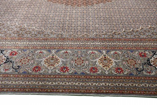 Corner detail of New Tabriz rug showing border pattern and Cork pile