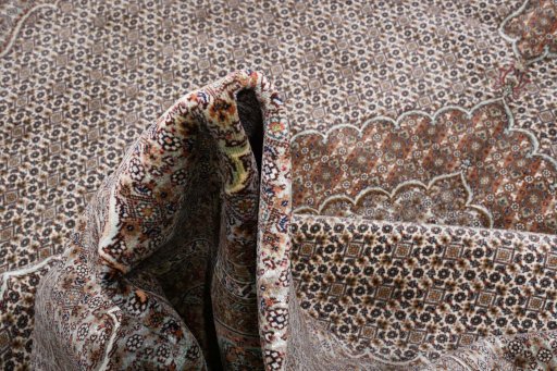 Backside of handmade New Tabriz rug showing knot structure and weave density