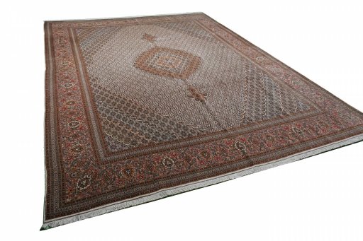 Corner detail of New Tabriz rug showing border pattern and Cork pile