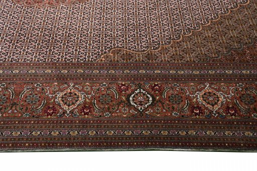 Corner detail of New Tabriz rug showing border pattern and Cork pile