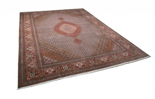 Corner detail of New Tabriz rug showing border pattern and Cork pile