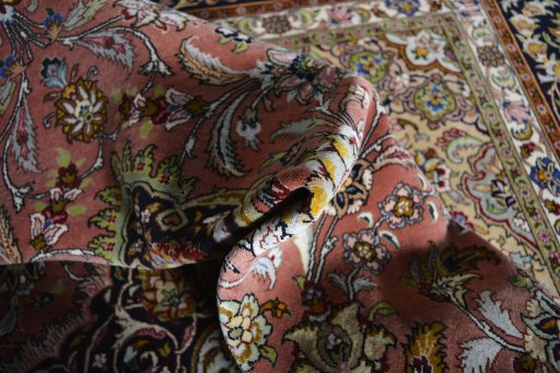 Backside of handmade New Tabriz rug showing knot structure and weave density