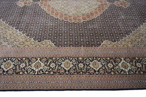Corner detail of 2000s Tabriz rug showing border pattern and Cork pile