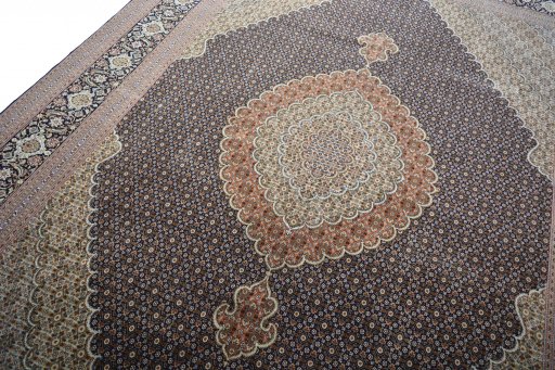 Backside of handmade 2000s Tabriz rug showing knot structure and weave density
