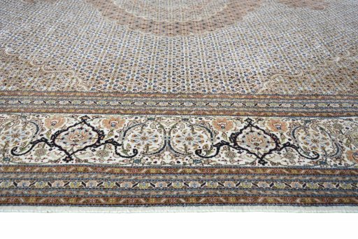 Corner detail of 2000s Tabriz rug showing border pattern and Cork pile