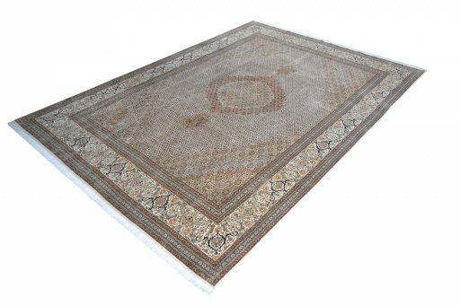 Corner detail of 2000s Tabriz rug showing border pattern and Cork pile
