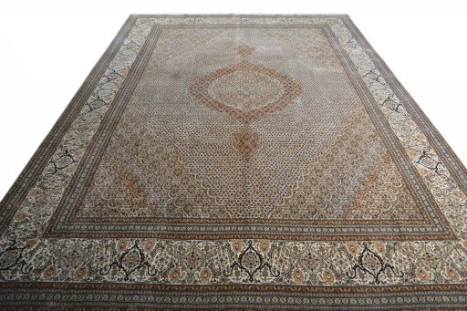 Surface texture of 2000s Tabriz rug with natural Cork and intricate pattern