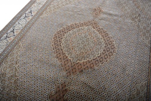 Backside of handmade 2000s Tabriz rug showing knot structure and weave density
