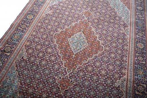Backside of handmade New Tabriz rug showing knot structure and weave density