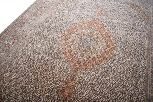 Backside of handmade New Tabriz rug showing knot structure and weave density