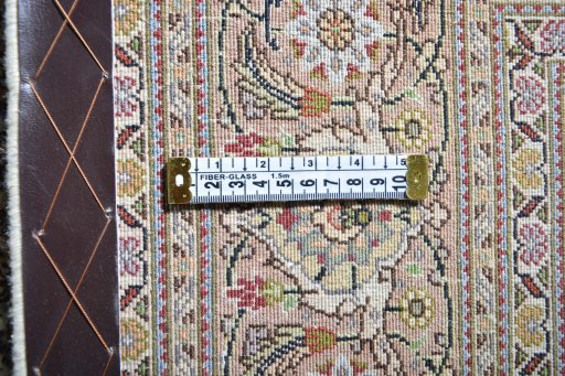 Backside of handmade Unknown Tabriz rug showing knot structure and weave density