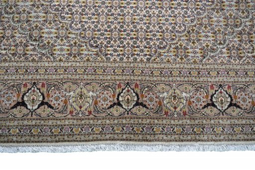 Full view of Unknown Tabriz rug from Iran / Persia, 337 × 143 cm in Beige tones