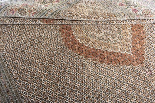 Surface texture of 2000s Tabriz rug with natural Cork and intricate pattern