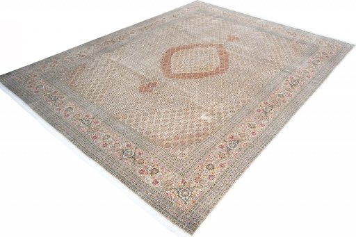 Corner detail of 2000s Tabriz rug showing border pattern and Cork pile