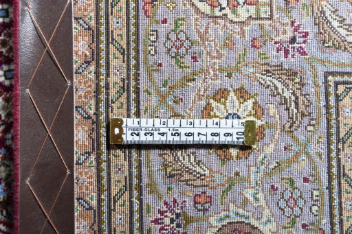 Backside of handmade New Tabriz rug showing knot structure and weave density