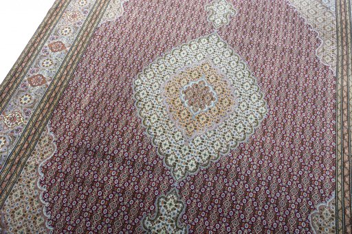 Backside of handmade New Tabriz rug showing knot structure and weave density