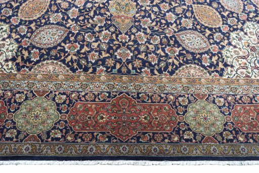 Corner detail of 1970s Tabriz rug showing border pattern and Wool pile