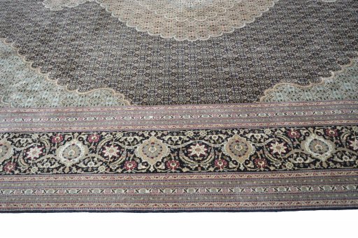 Corner detail of New Tabriz rug showing border pattern and Cork pile