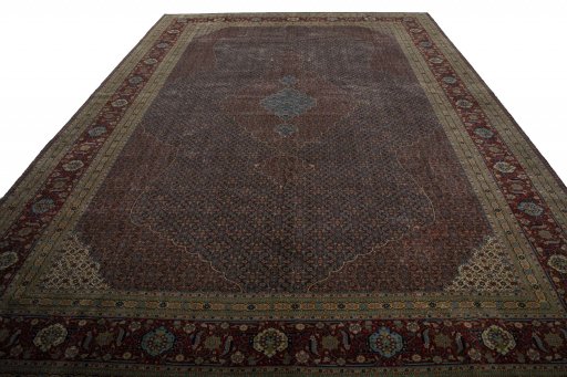 Surface texture of 1930s Tabriz rug with natural Wool and intricate pattern