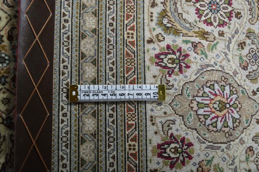 Backside of handmade New Tabriz rug showing knot structure and weave density