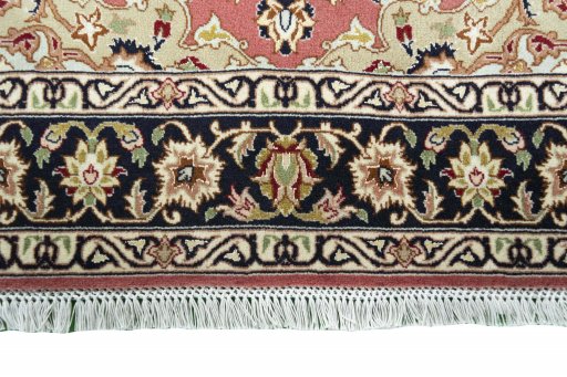 Corner detail of New Tabriz rug showing border pattern and Cork pile