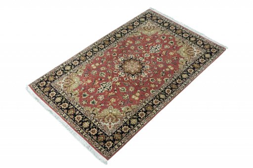 Corner detail of New Tabriz rug showing border pattern and Cork pile