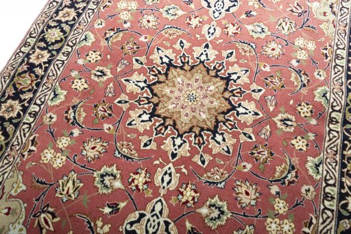 Backside of handmade New Tabriz rug showing knot structure and weave density