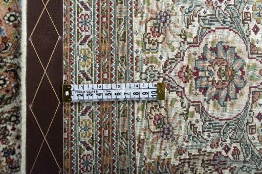 Backside of handmade New Tabriz rug showing knot structure and weave density