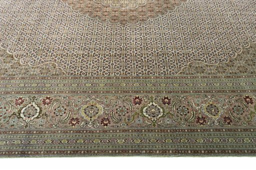 Corner detail of 2000s Tabriz rug showing border pattern and Cork pile