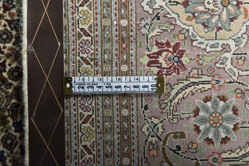 Backside of handmade 2000s Tabriz rug showing knot structure and weave density